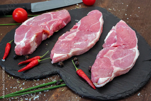 Lamb steak on the wooden plate