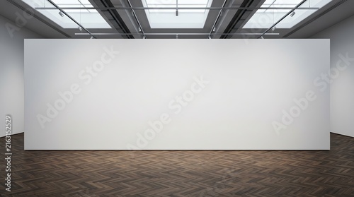 Large blank white wall in a modern art gallery with dark wood floor.
