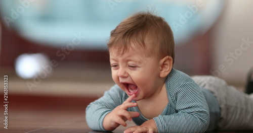 фотографія Unhappy Baby boy infant toddler complaining crying out