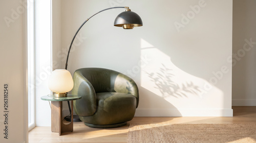 Contemporary reading corner with black arc floor lamp, ceramic table lamp, and olive leather chair