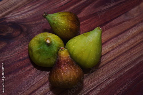 Closeup of figs on a wooden tray