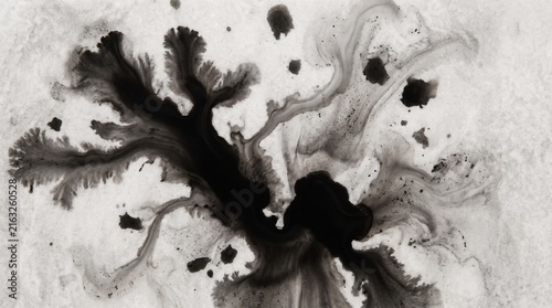 Abstract black ink splatter explosion on white background for modern design elements