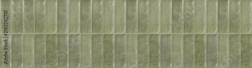Photography Sage green glazed ceramic subway tiles arranged vertically with subtle tonal var