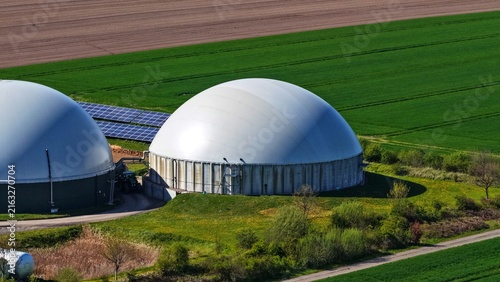 Konstfotografi Biogas Digester with Solar Panels in Agricultural Landscape