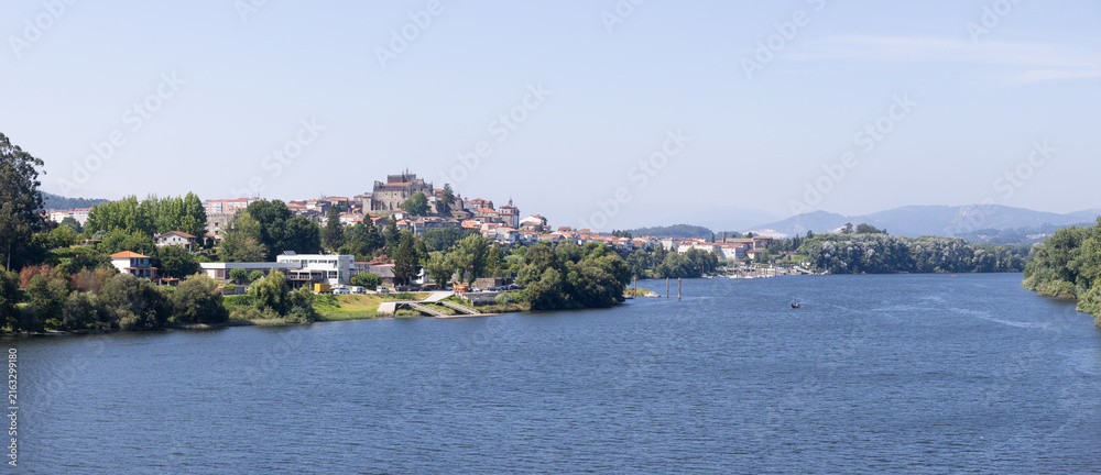Fototapeta premium panoramic view of tui town and cathedral over minho river in galicia spain