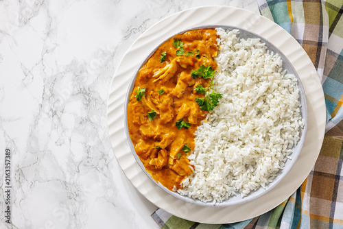 Chicken korma with white rice on a plate