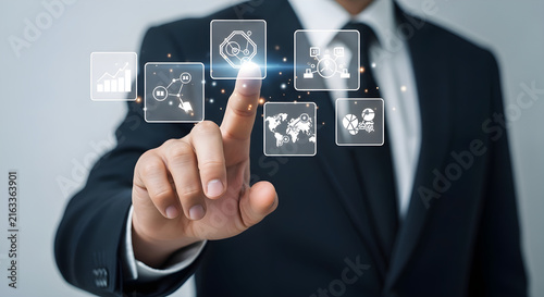 Businessman interacting with a digital holographic interface representing global business network management and innovative data technology solutions