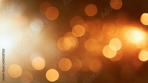 Warm amber bokeh background with soft yellow glow for design projects
