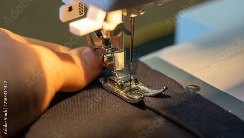 Fotografie Close-up of sewing machine presser foot