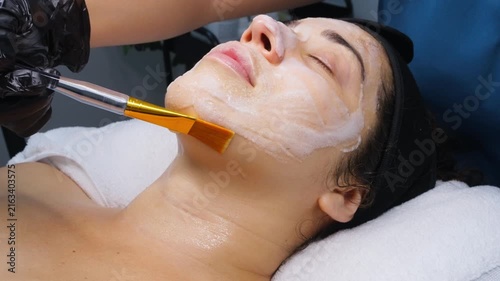 Mexican patient receiving a facial mask with a brush