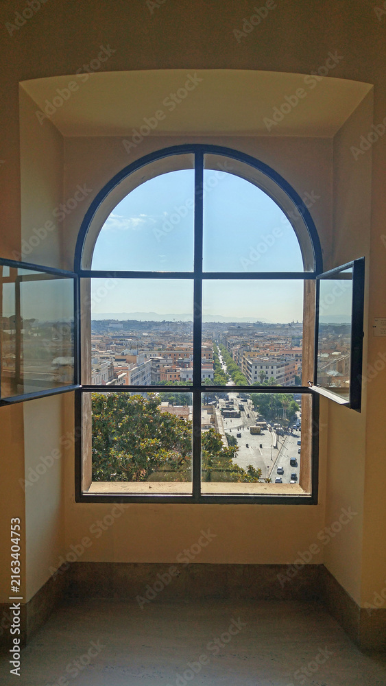 Fototapeta premium Scenic cityscape of rome through a window