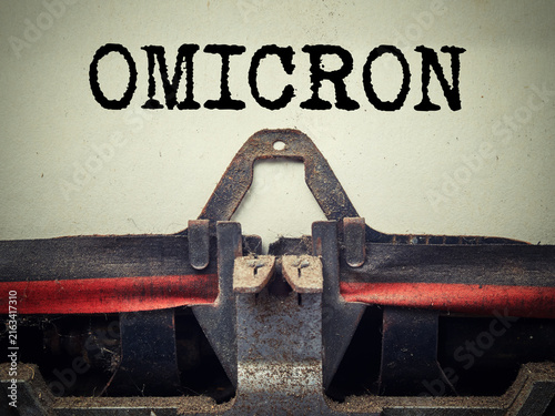 Картината върху платно Omicron variant typed on retro typewriter close up