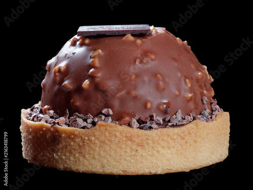 Chocolate cupcake delicious pastry closeup decorated with chocolate table copyspace. Inside filled with cream of chocolate for yummy dessert or snack