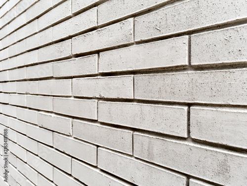 weathered textured white brick wall perspective view
