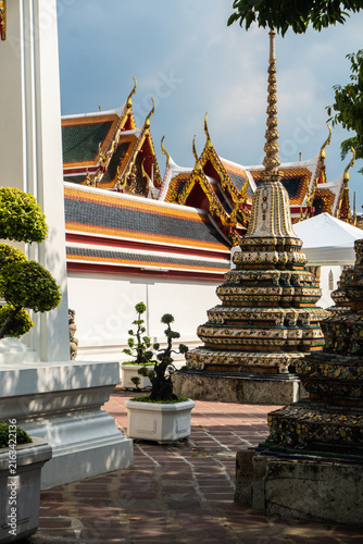 Details of the Grand Palace in Bangkok, Thailand, featuring its architecture and Buddhist religious images.