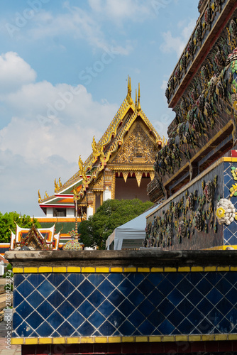 Details of the Grand Palace in Bangkok, Thailand, featuring its architecture and Buddhist religious images.