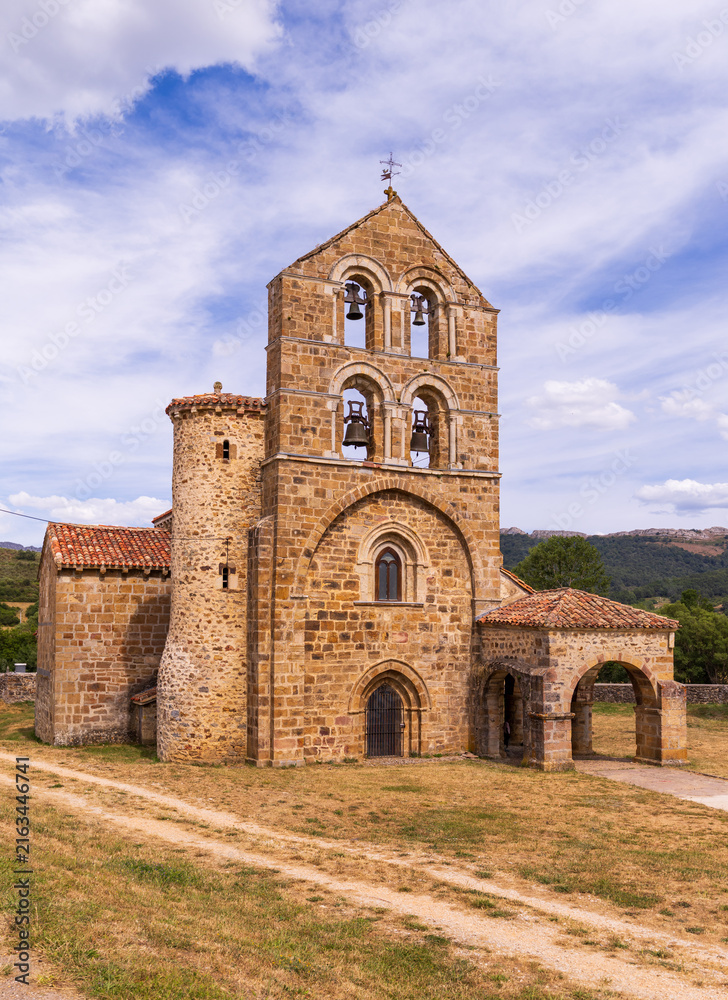 Fototapeta premium Romanesque collegiate church in north of Palencia, featuring Latin cross plan, single nave, and three semicircular apses