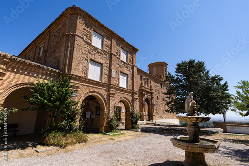 Fotografía Basilica of Virgin Mary or Basilica de Nuestra Senora del Romer, building complex - arched gallery and church building historical landmark and sacred place for believers