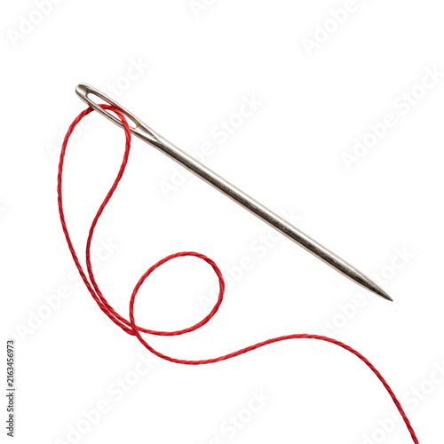 Canvastavla Close-up of a sewing needle with red thread looped through its eye