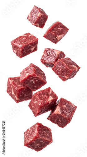 Falling raw beef cubes isolated on transparent background