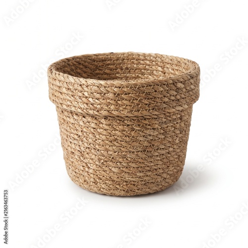 Small woven plant basket made of natural jute fiber isolated on a white background