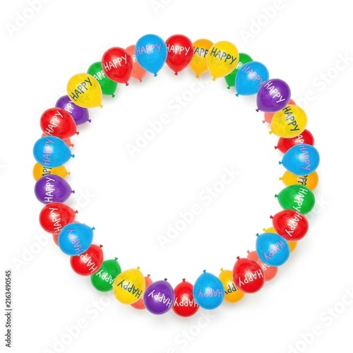 Circular border frame composed of multi-colored balloons with the word HAPPY printed on them, arranged in a ring on a white background with central copy space for text.