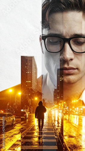Double exposure portrait of a man with city street night life and urban architecture