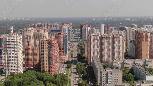 Forward drone flight with zoom on district