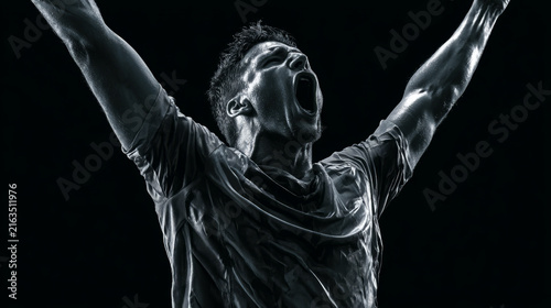 Energetic sportsman expressing joy and determination in a striking black and white photograph