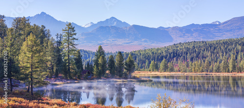 Mountain lake on an autumn morning, forest shores, panoramic view