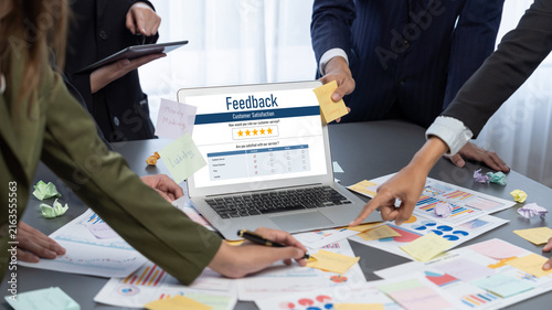 Analyst team use sticky note for creative and analytic brainstorm for business idea with BI data dashboard on laptop screen. Analysis financial data visualization tech for marketing strategy. Prodigy