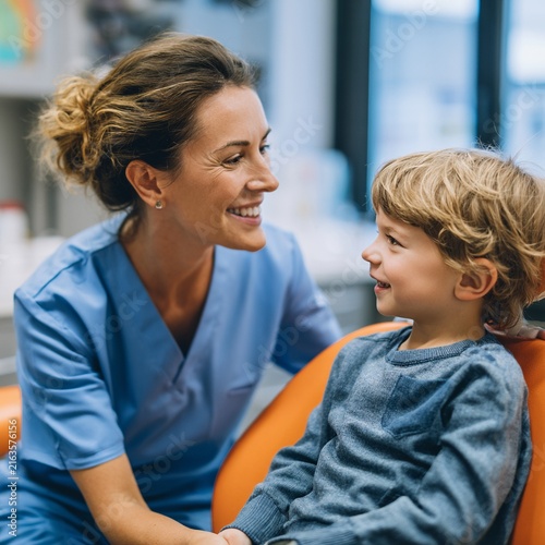 Female Pediatric Dentist Reassuring Smiling Boy Before Dental Checkup