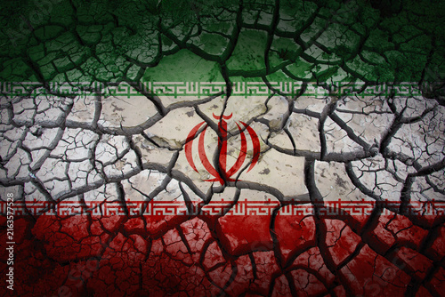 Iranian flag superimposed on cracked parched earth