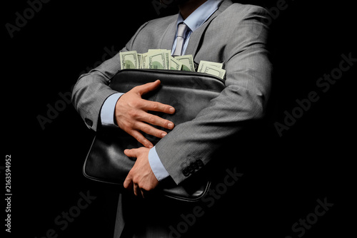 Canvas Print Corruption and bribery in business, businessman hiding money in a briefcase, ill
