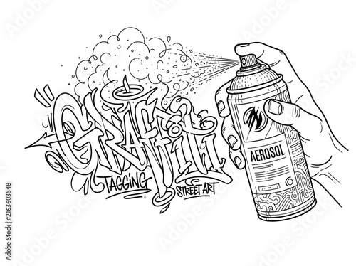 Hand holding a spray paint can creating graffiti lettering art in black and white.