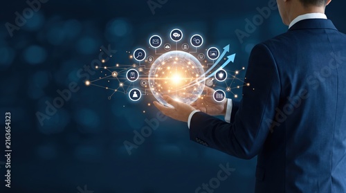 Businessman holding glowing hologram sphere with global network icons and rising arrows, digital technology for innovation, data analysis, cloud computing, internet connection
