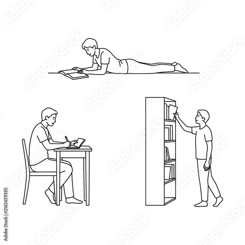 Young man studying with book on floor writing at desk and selecting book from shelf