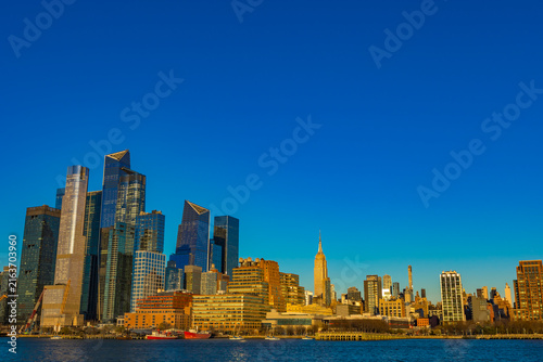 Bright skyline view of New York City under a clear blue sky
