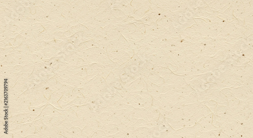 Textured beige paper background with subtle fibers