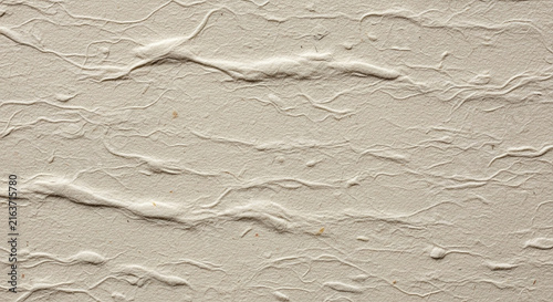 Textured beige crumpled paper background surface