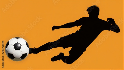 Silhouette of a soccer player kicking ball against vibrant orange background.