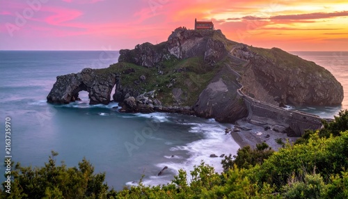 Gaztelugatxe islet at sunset with stone bridge and chapel.