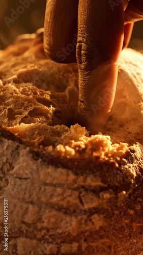 Extreme Close-Up Of A Finger Pressing Into The Golden Sourdough Bread Crust
