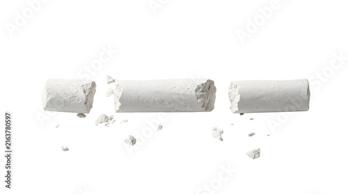 Broken white chalk pieces scattered on transparent background for educational or craft use