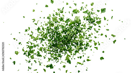 Fresh chopped parsley leaves scattered on white background for culinary garnish and seasoning