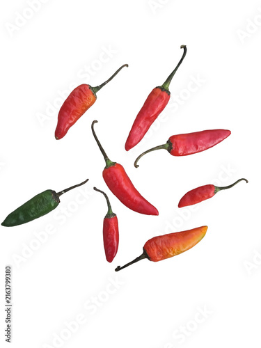 Foto Fresh Assorted Red and Green Chili Peppers Scattered on White Background