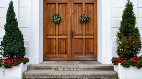 Beautiful Wooden Entrance Door Surrounded by Greenery and Red Flowers for Welcoming Atmosphere