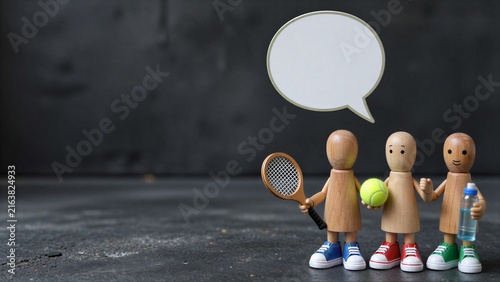 Three wooden figures with tennis gear stand, one holding a speech bubble.