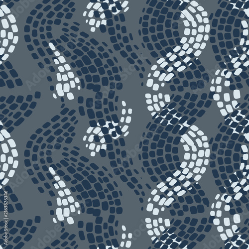 Abstract snakeskin seamless pattern with blue mosaic scales. Modern reptile texture for textile, fabric print, and wallpaper.