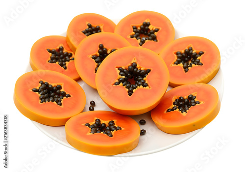Bright orange papaya slices arranged on a white plate, showing the star-shaped center with black seeds.
